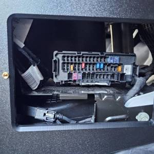 Passenger side access to factory fuse panel